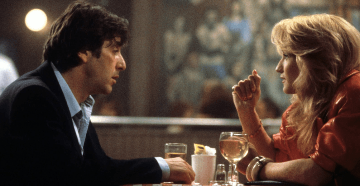 Picture of Al Pacino and Ellen Barkin chatting over drinks in movie Sea of Love.